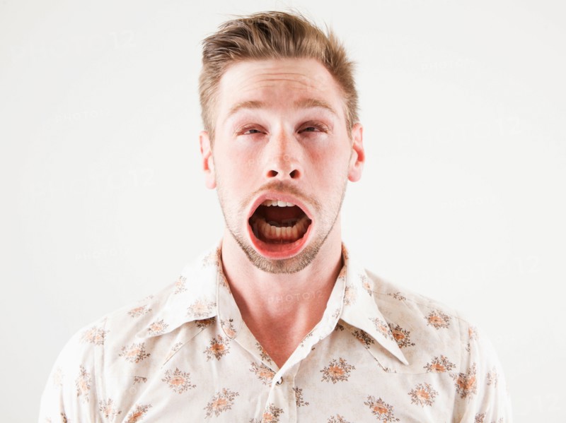 Studio shot of man with windblown mouth. Photo: Jessica Peterson