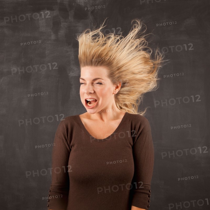 Studio shot of woman with windblown mouth. Photo: Jessica Peterson