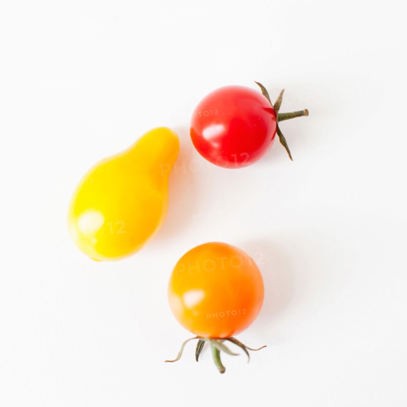 Studio Shot of three Cherry Tomatoes. Photo : Jessica Peterson