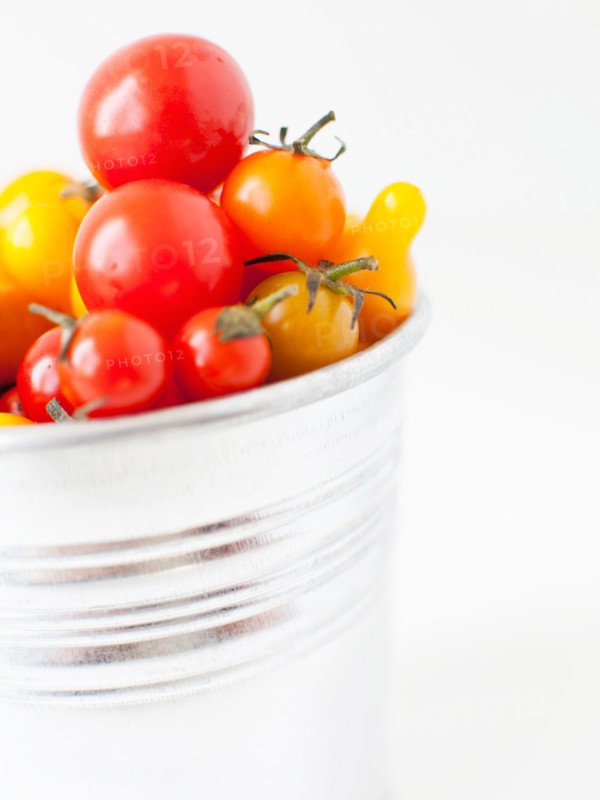 Studio Shot of Cherry Tomatoes in plastic container. Photo: Jessica Peterson