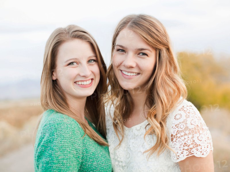 Portrait of two young women cheek to cheek. Photo : Jessica Peterson