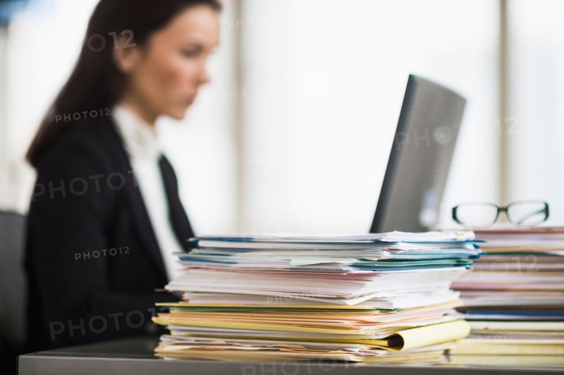 Businesswoman working in office.