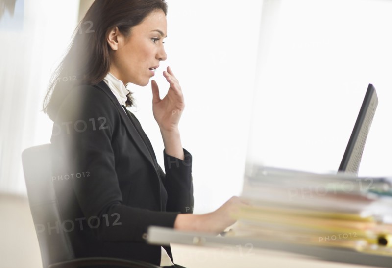 Businesswoman using computer.