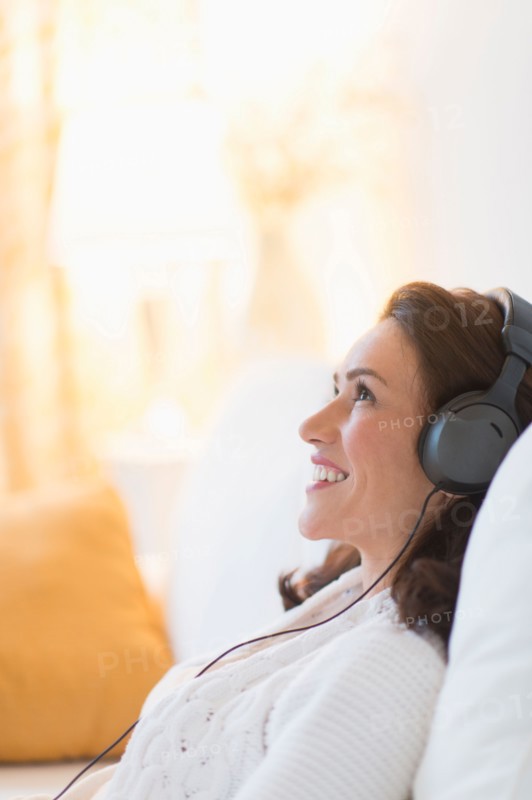 Woman listening to music at home.