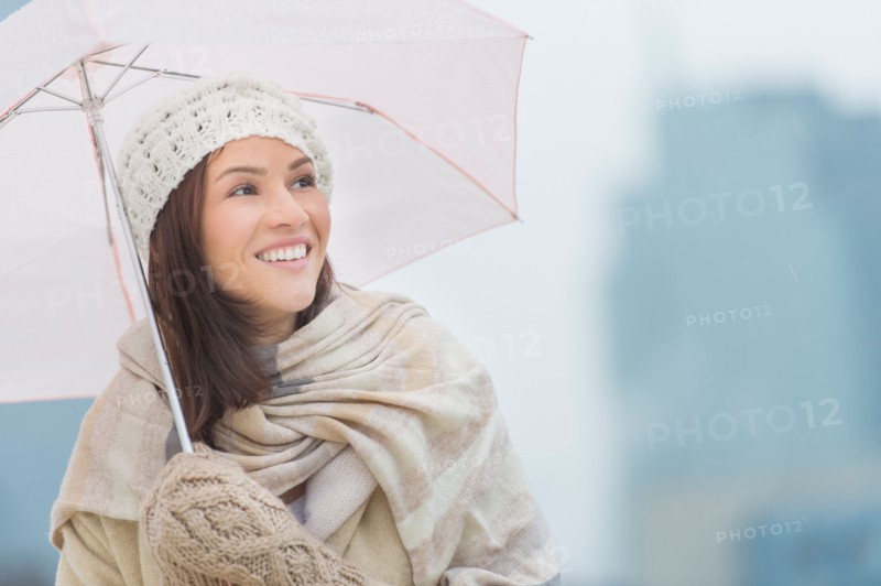 Portrait of woman with umbrella.
