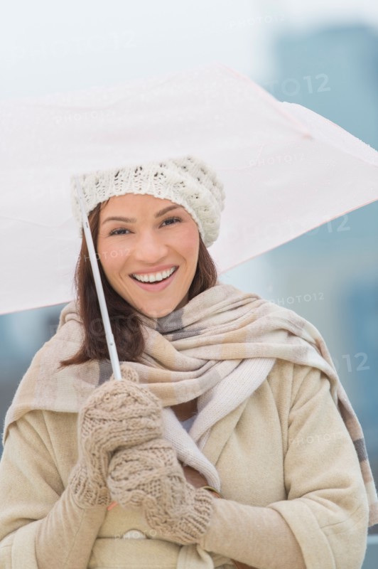 Portrait of woman with umbrella.