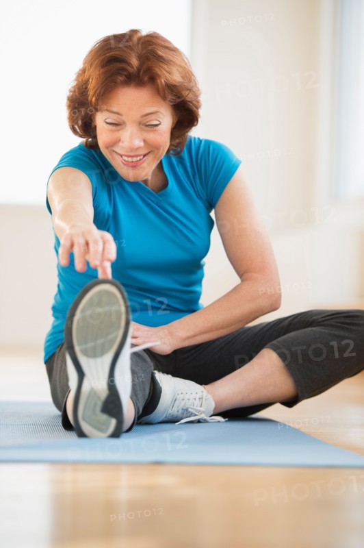 Senior woman stretching.