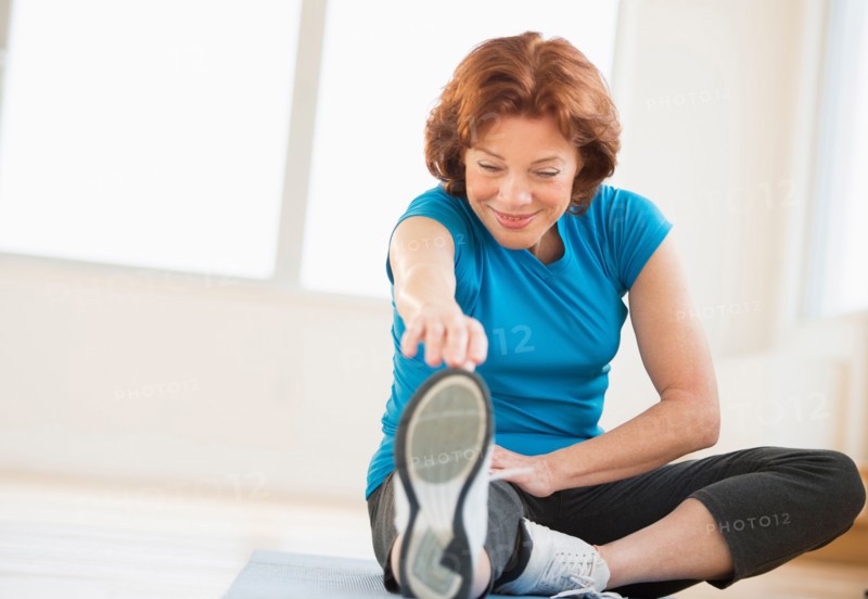 Senior woman stretching.