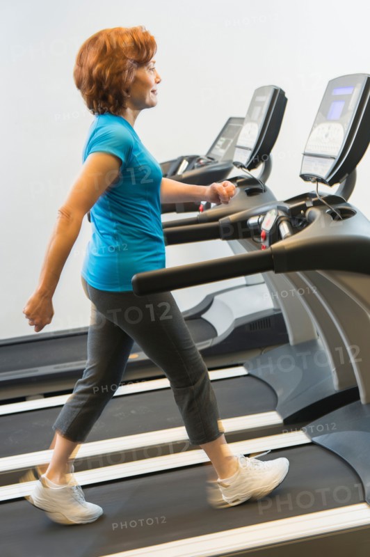 Senior woman on treadmill.