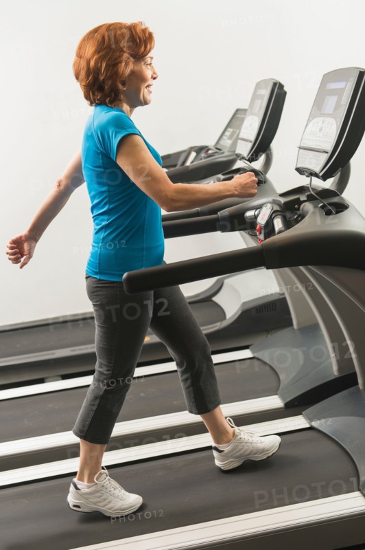 Senior woman on treadmill.