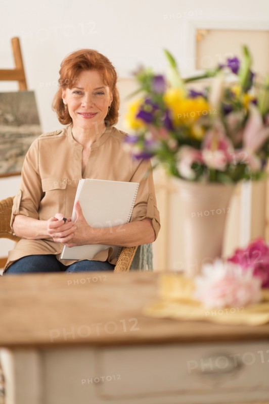 Portrait of female artist in studio.