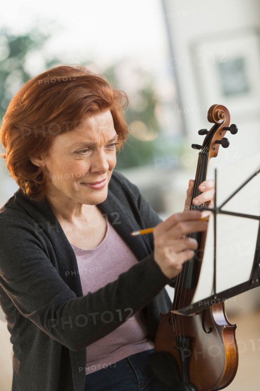 Senior woman composing music.