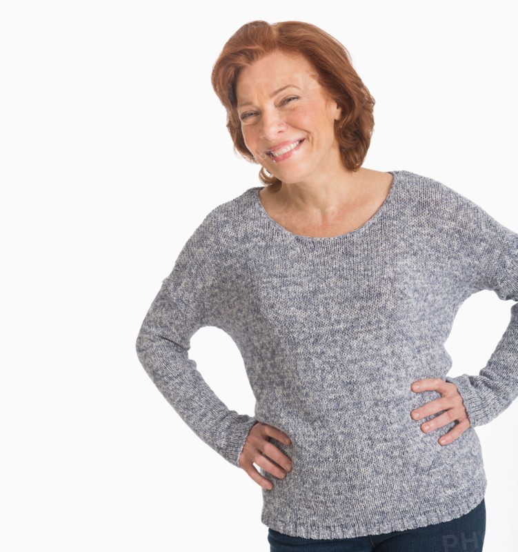 Studio shot of senior woman smiling.