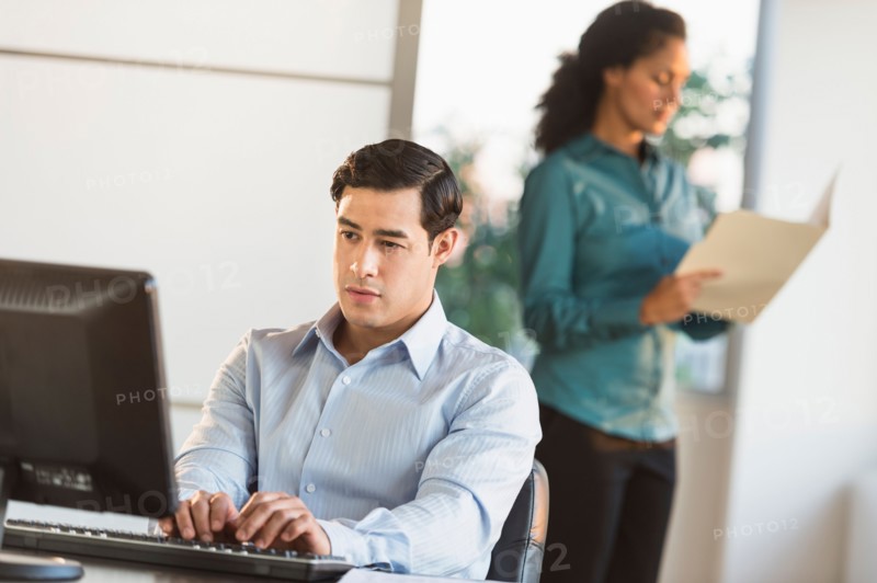 Man and woman working in office.