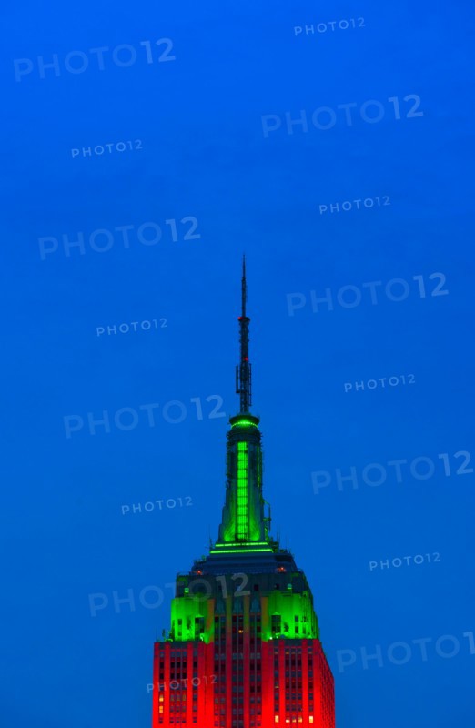 Empire State Building illuminated in red and green.