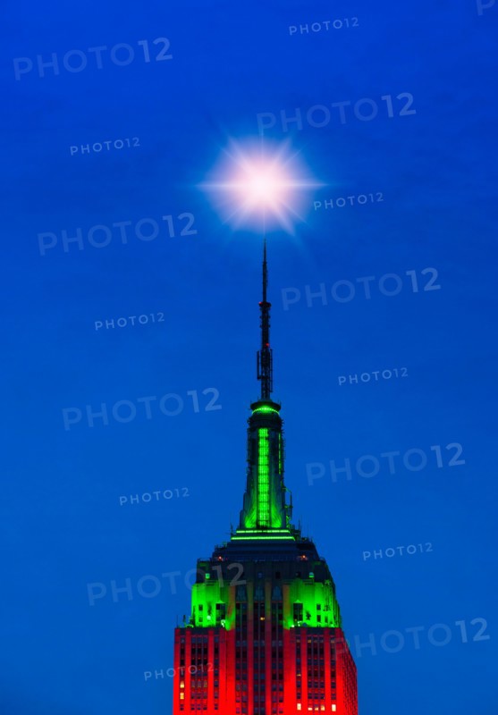 Empire State Building illuminated in red and green.