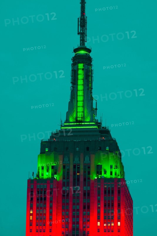 Empire State Building illuminated in red and green.