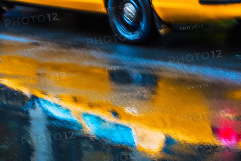 Yellow cab in blurred motion.