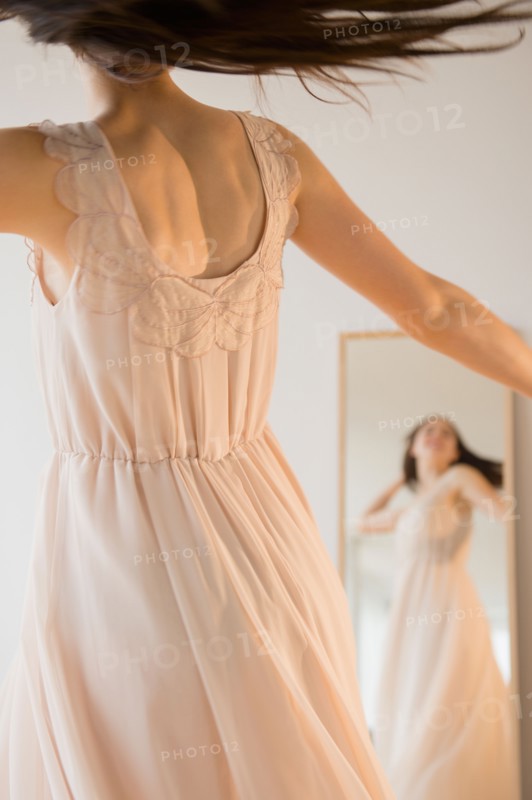 Bride trying on wedding dress