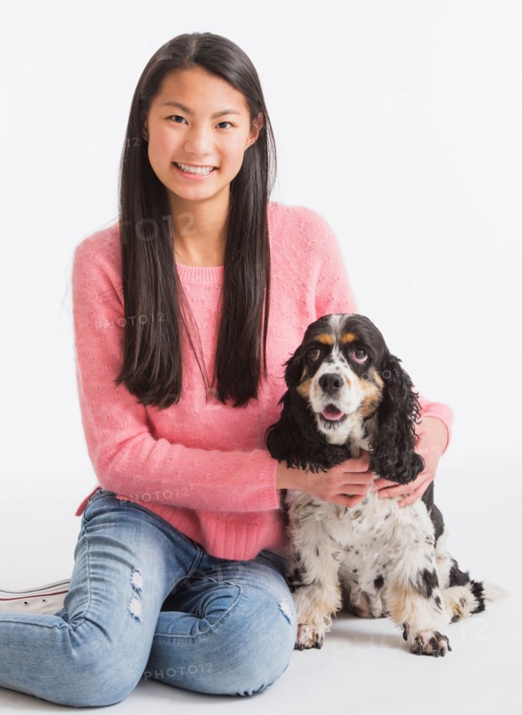 Portrait of teenage girl ( 16-17 years) with dog