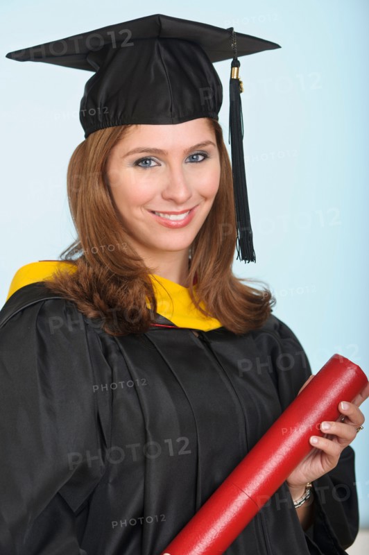 Portrait of graduate student holding diploma