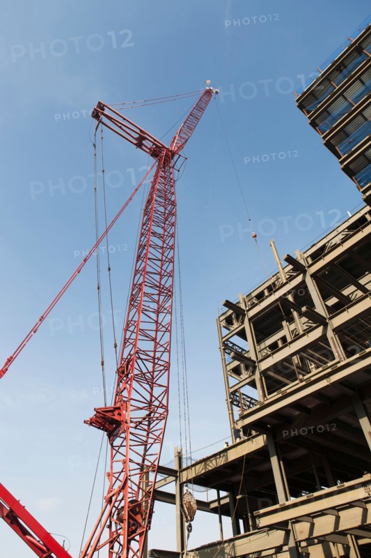 Low angle view of crane and building under construction