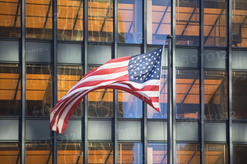 American flag with building in background