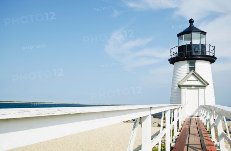 Lighthouse on sandy beach
