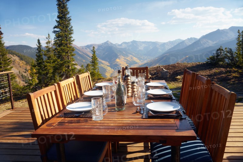 Outdoor table and chairs on wooden terrace