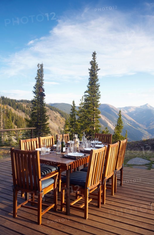Outdoor table and chairs on wooden terrace