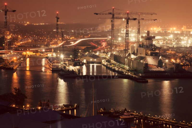 Cityscape with cranes at night