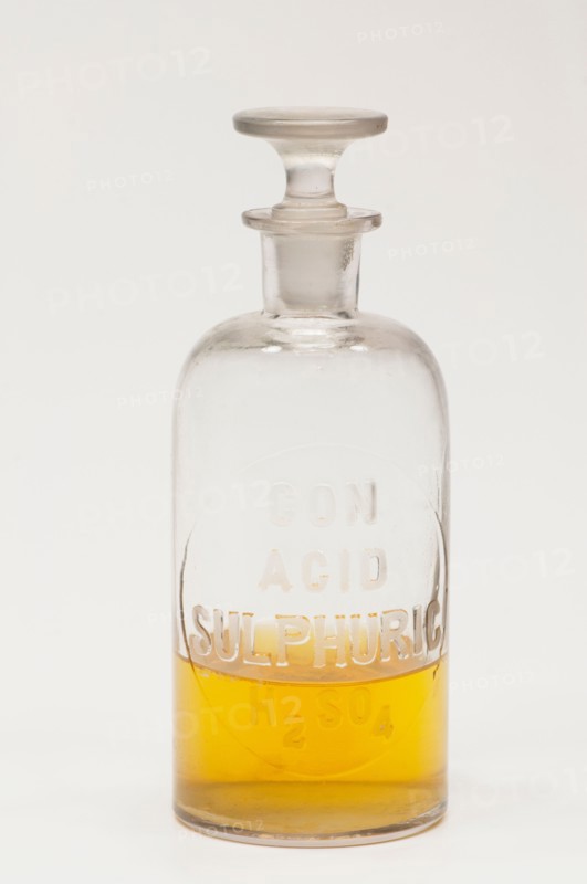 Laboratory flask containing yellow liquid