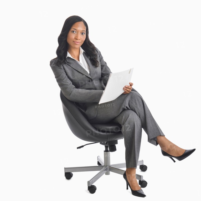 Portrait of businesswoman sitting in chair.
