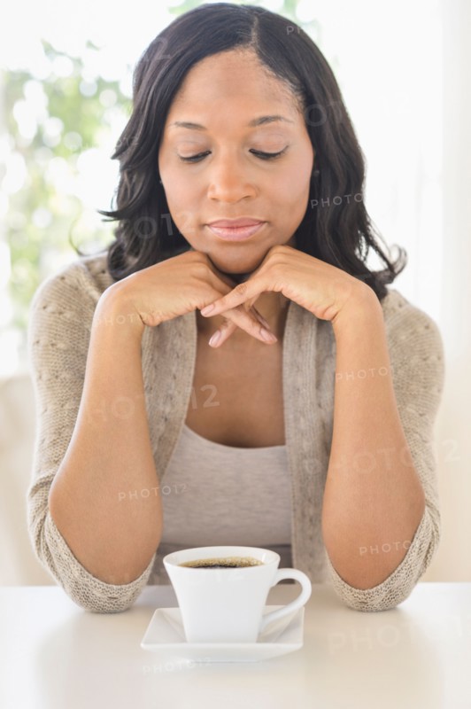Woman drinking coffee.