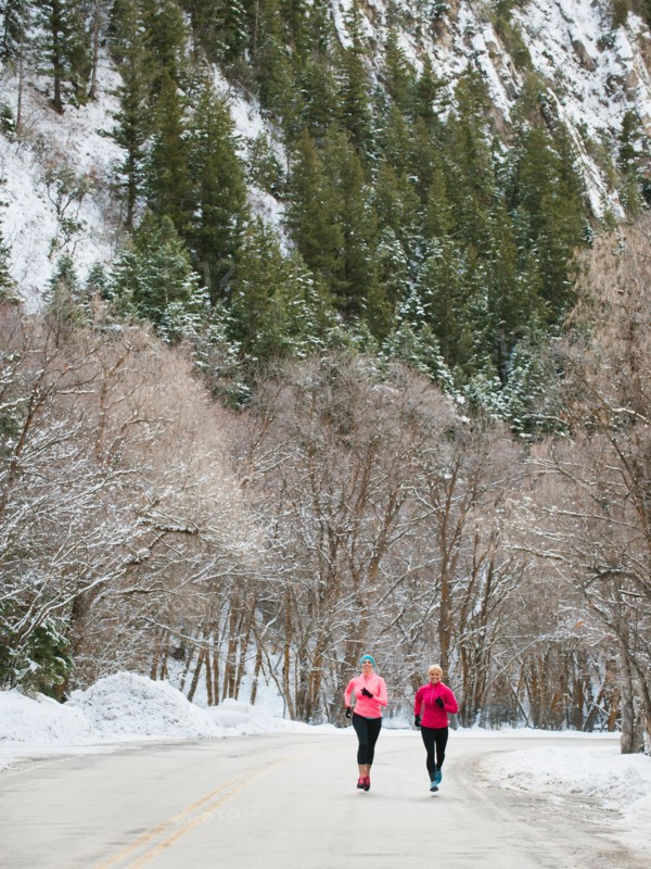 Two women jogging in winter