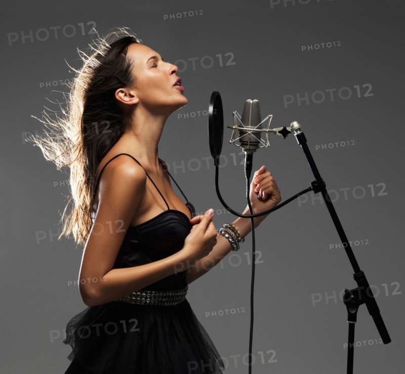 Studio shot of singing rockstar