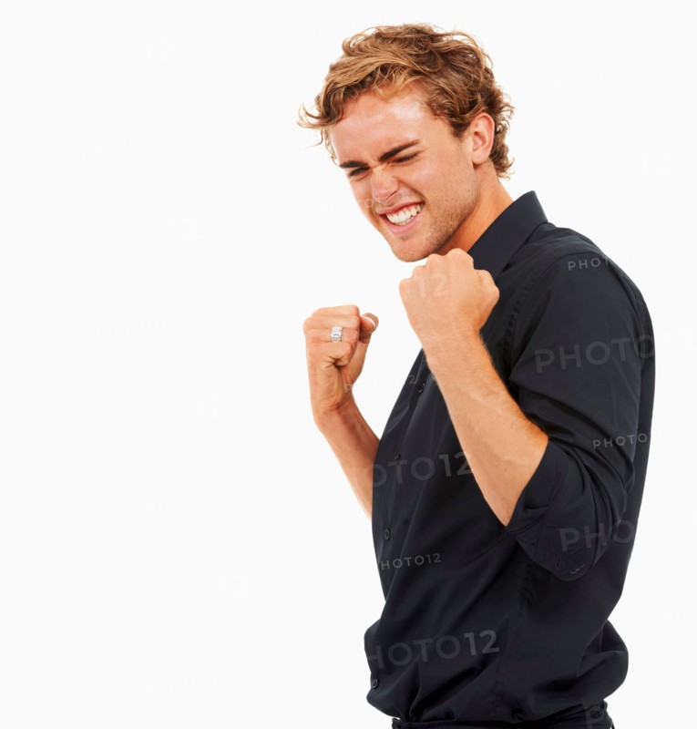 Studio Shot, Portrait of young man with arms raised and clenched fists