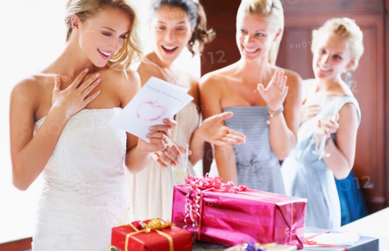 Bride  and bridesmaids unpacking gifts