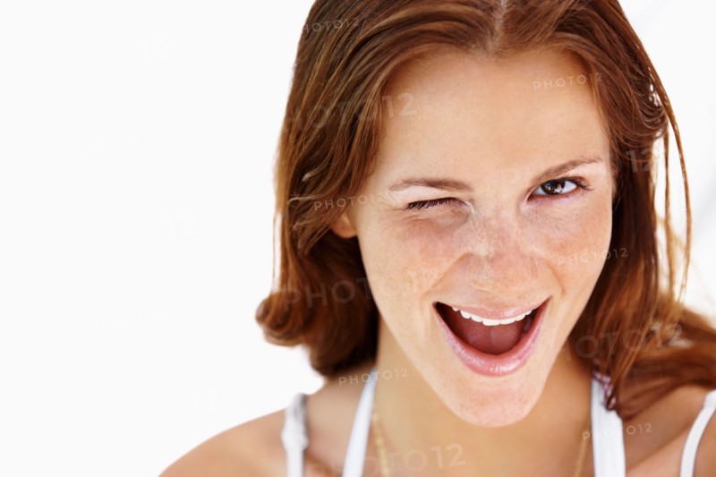 Studio portrait of winking  woman