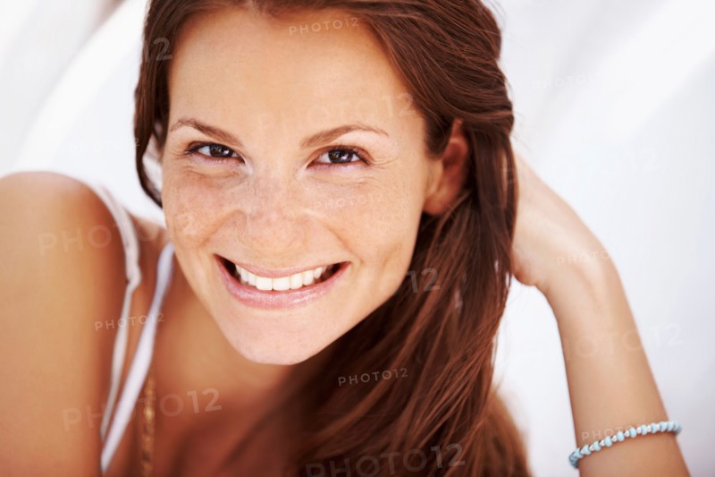 Studio portrait of woman smiling