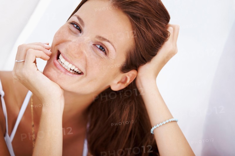 Studio portrait of woman smiling