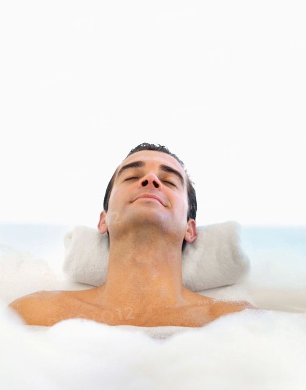 Man relaxing in bathtub