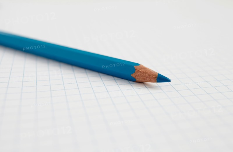 Blue pencil on graph paper, studio shot