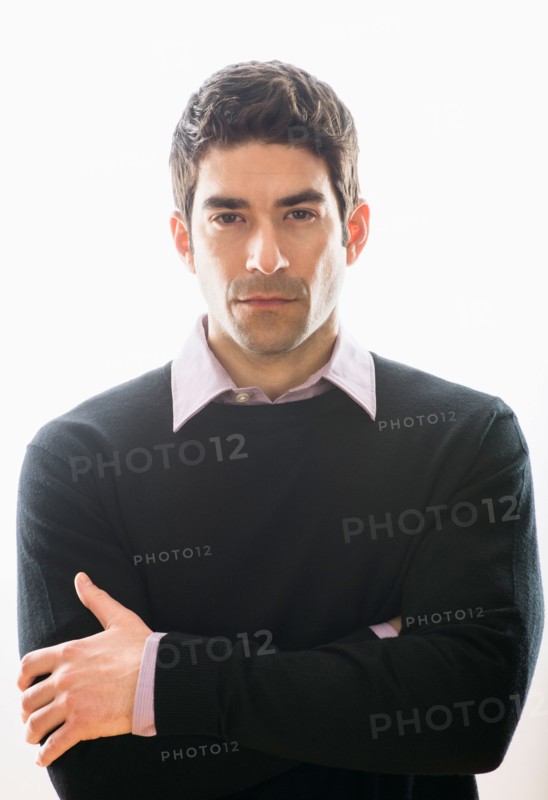 Studio portrait of mid adult man.