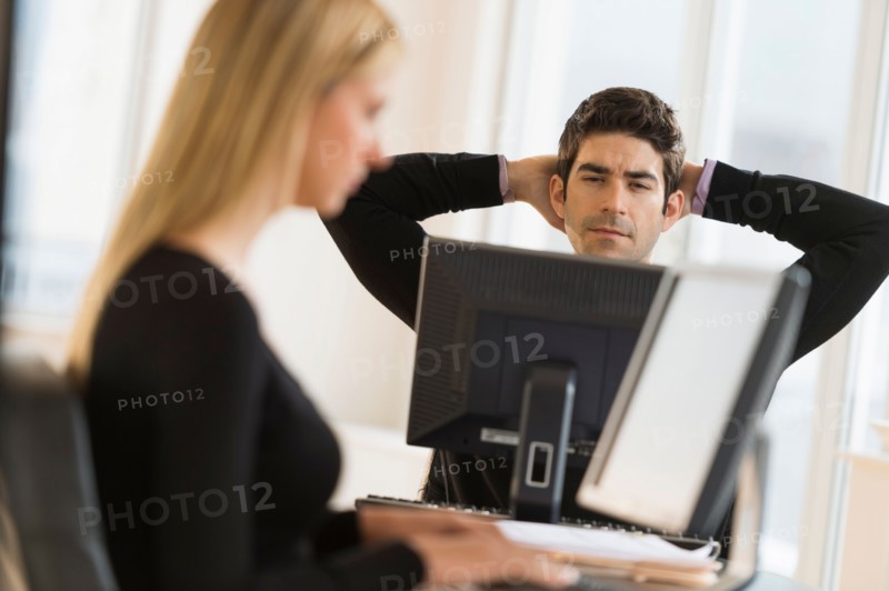 Business man and woman working in office.