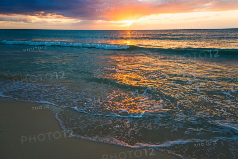 Sun setting over sea. Jamaica.