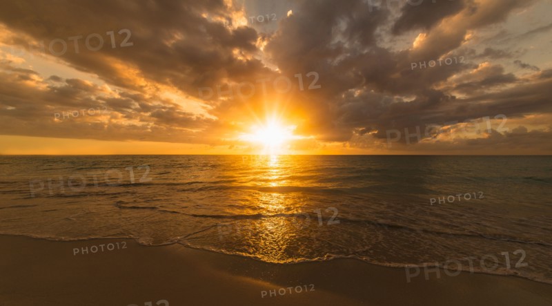 Sun setting over sea. Jamaica.