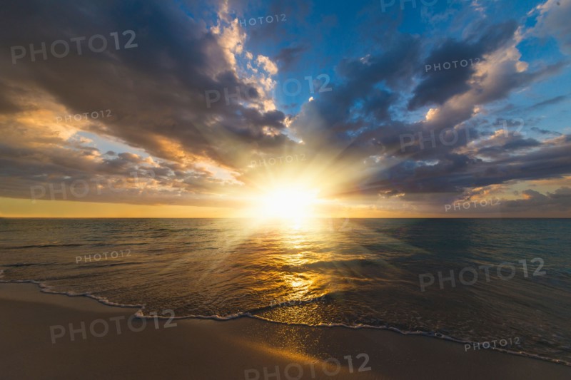 Sun setting over sea. Jamaica.