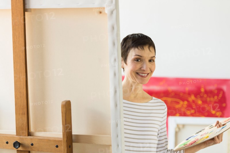 Portrait of female artist in her studio.