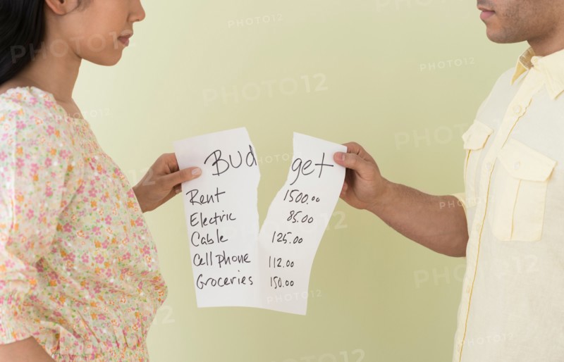 Young couple fighting over home budget.